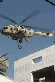 helicopter dropping barrel bombs in Syria
